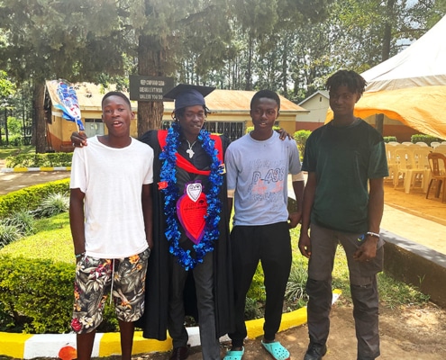 Four former street boys from Kampala