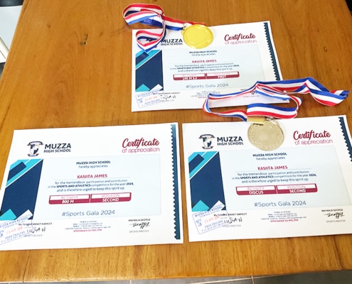 A boy from the streets of Kampala earns awards and certificates