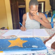 Former street boy doing his homework