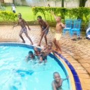Former street children swimming together