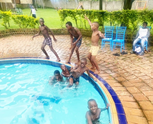 Former street children swimming together