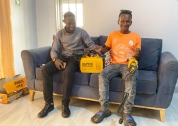 Boy from the charity with donated welding equipment