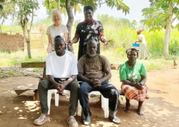 Jane and Peace visiting a family in Guju
