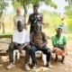 Jane and Peace visiting a family in Guju