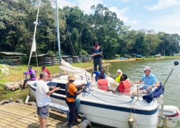 Jane and boys board the sailing boat