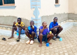 Four of the boys at the charity having breakfast