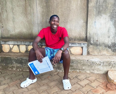 Former street boy at the charity having taken his school exams