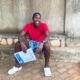 Former street boy at the charity having taken his school exams