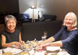 Jane and Christine enjoying a meal