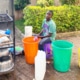 Former homeless boy washing up dishes