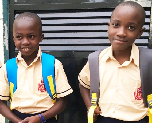 Two street boys from Kampala going to school in 2017