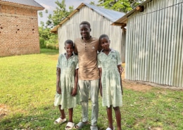 Former homeless boy with his sisters