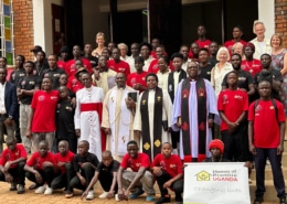 All the boys, clergy, and friends at the charity anniversary party outside the church