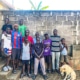 Boys at the charity home welcoming someone back