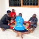 New boys at the charity are playing board games